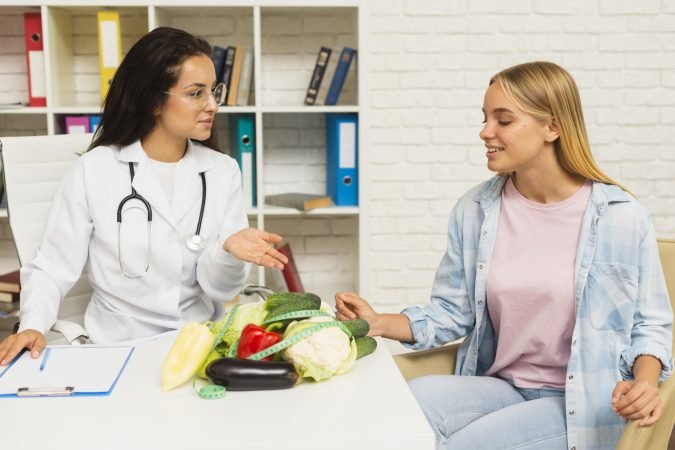 medium-shot-doctor-talking-patient-about-vegetables